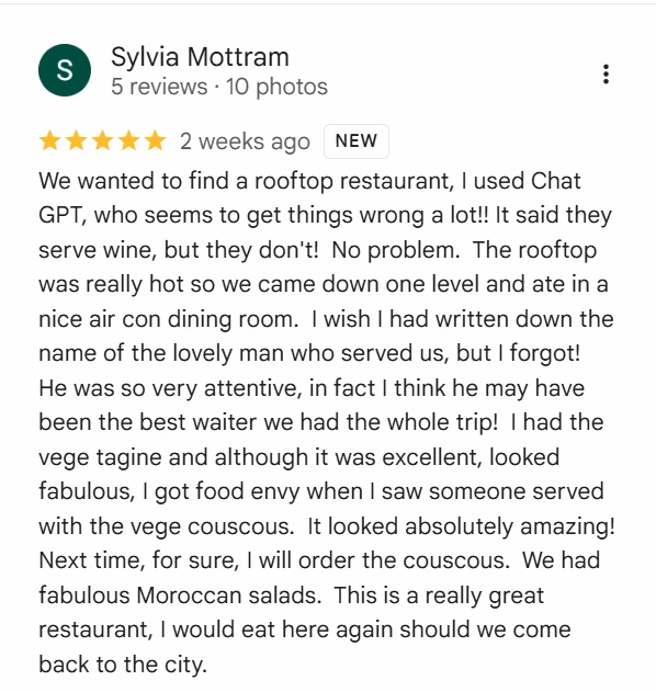 Real Google Maps review by guest Sylvia Mottram, five stars: “We wanted to find a rooftop restaurant, I used Chat GPT… He was so very attentive, in fact I think he may have been the best waiter we had the whole trip! I had the vege tagine and although it was excellent… This is a really great restaurant, I would eat here again should we come back to the city.”